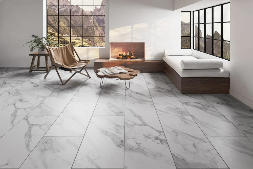 Spacious living room featuring marble flooring, a cozy chair, and large windows with a view.